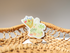 small clear sticker of farmers market mesh bag with fruits and veggies inside and a bouquet of flowers sticking out of the side.