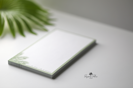 olive green and white notepad with green foliage in bottom left corner that says feel the fear and do it anyway.
